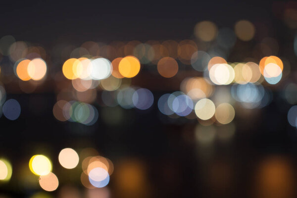 Defocused city night light blurred with bokeh abstract background