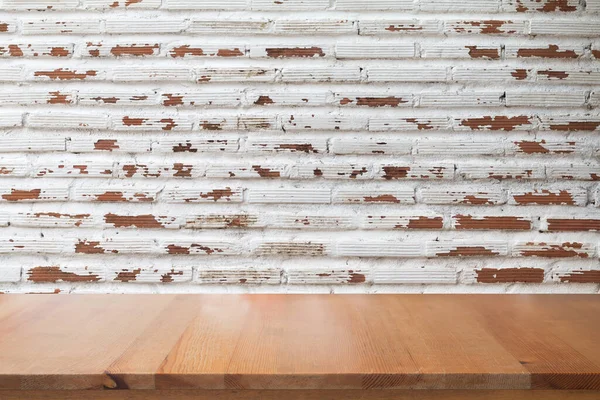 Empty desk with White brick wall for vintage abstract background.