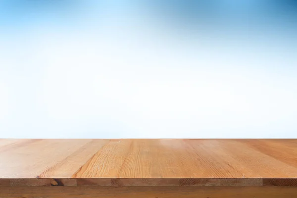 Empty desk with blue gradient blurred bokeh abstract background.