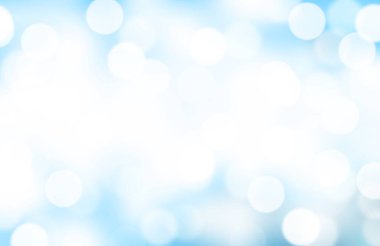 Mavi gradyan arkaplandaki bulanık bokeh ya da ışıklar.