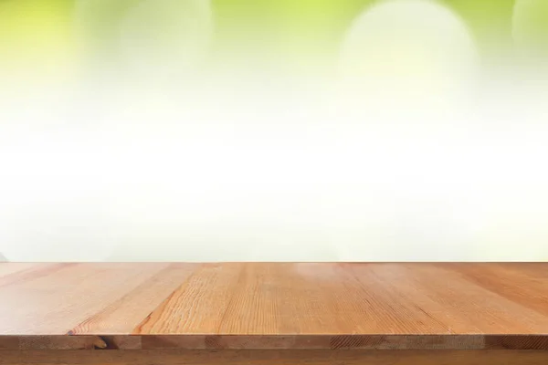 Empty of desk with blurred light green gradient bokeh abstract background.