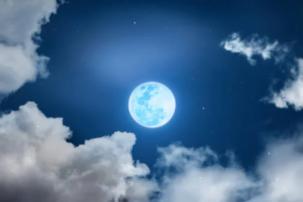 Mystical Night sky background with full moon, clouds and stars. Moonlight night with copy space for winter background.
