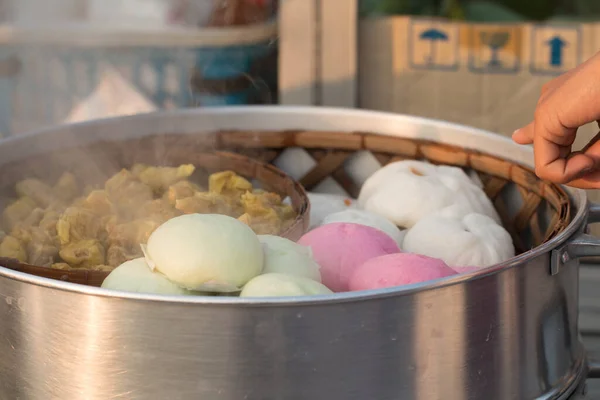 Steamed BBQ Pork Asian Buns or Chinese food's  steamed bun with Dim Sum in steamer pot.