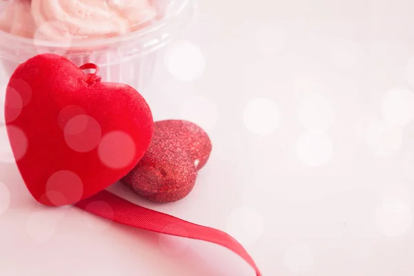 Valentines day concept, red decorate heart and dessert cup on sweet blurred background design for greeting card.