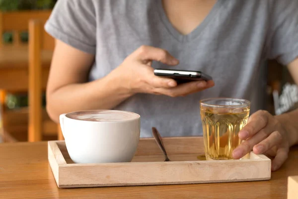 Woman enjoying warming drink, Late coffee in a cup.