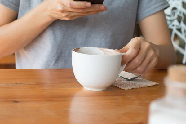 Woman enjoying warming drink, Late coffee in a cup.