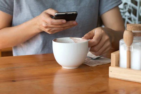 Woman enjoying warming drink, Late coffee in a cup.