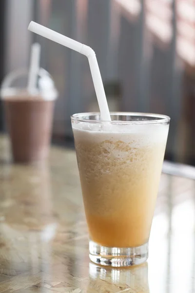 Iced tea drink in coffe shop on wooden desk, Sumer favorite drink.