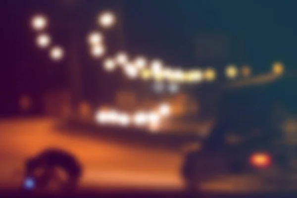 Blurred light on road in city with bokeh abstract background.