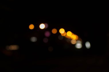 Yokedilmiş şehir gecesi filtrelenmiş Bokeh soyut arkaplanı.