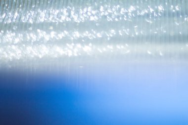 Gümüş folyo efekti bulanıklığı soyut arkaplan için birçok bokeh oluşturur.