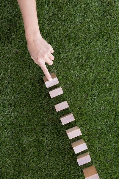 Hand Playing Domino Effect Stock Image