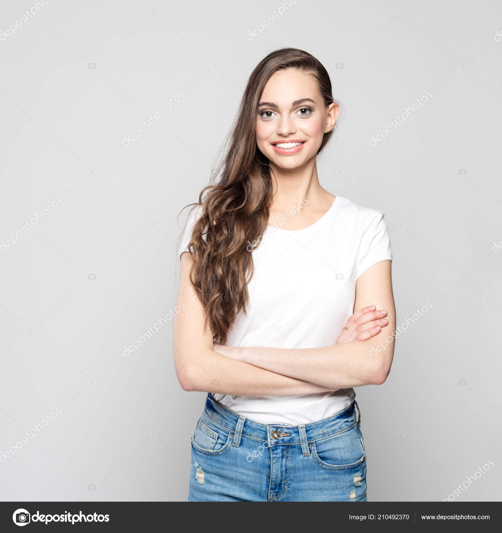 Portrait Cute Teenager Girl Wearing White Shirt Jeans Smiling Camera Stock Photo Snapic.PhotoProduction 210492370