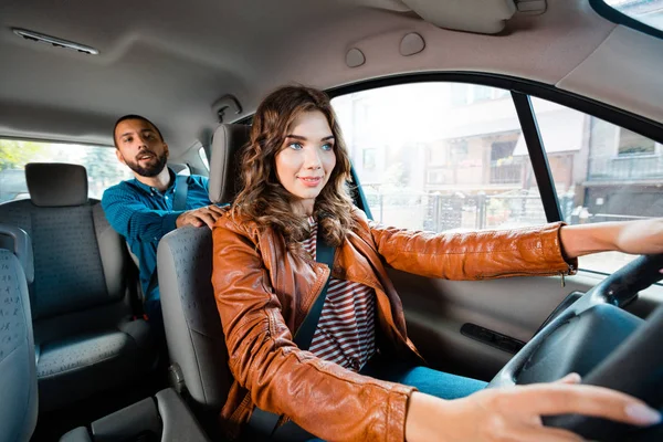 Female Taxi Driver Driving Car Male Passenger Sitting Background — Stock Photo, Image