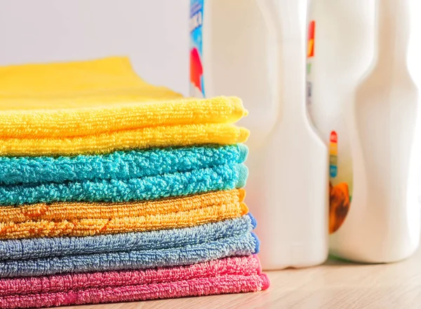 Clean, colorful, folded clothes. Means for washing clothes.