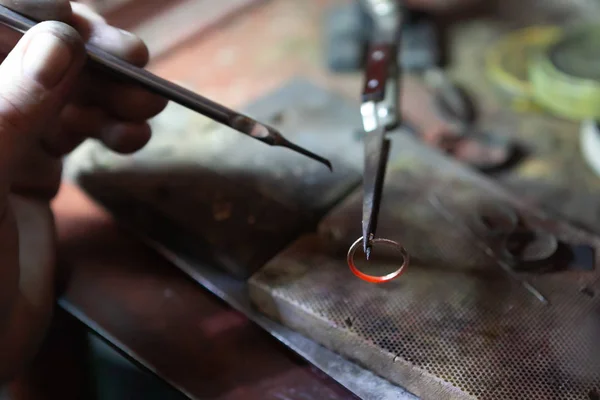 Work of the master, jeweler. Jewelry repair shop. Manufacturing of jewelry.