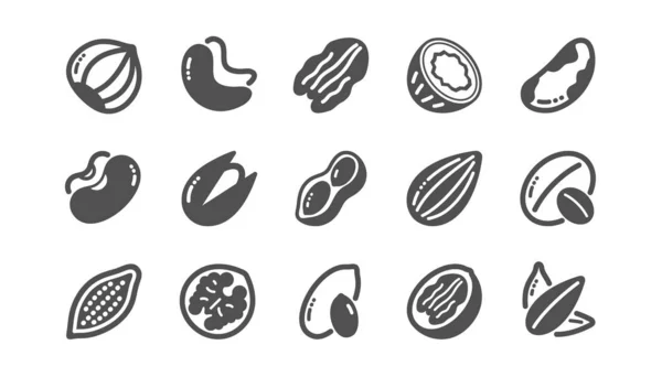 Noten en zaden iconen. Hazelnoot, amandel noot en pinda. Klassieke set. Vector — Stockvector