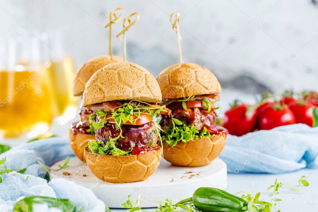 fresh delicious burgers in Form of Football (soccer)