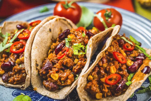 Mexican tacos with meat, beans and salsa. Top view