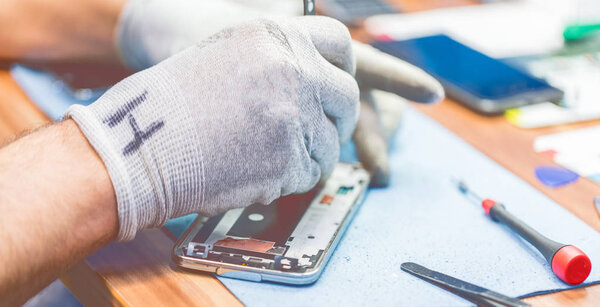 Close-up photos showing process of mobile phone repair