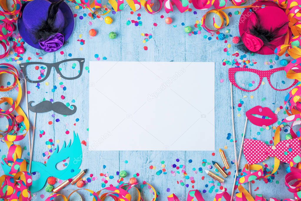 Colorful birthday frame with party items on stone background