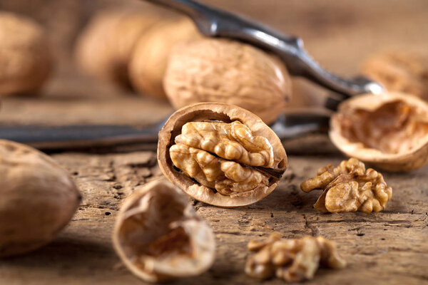 Walnut kernels on rustic old oak table.