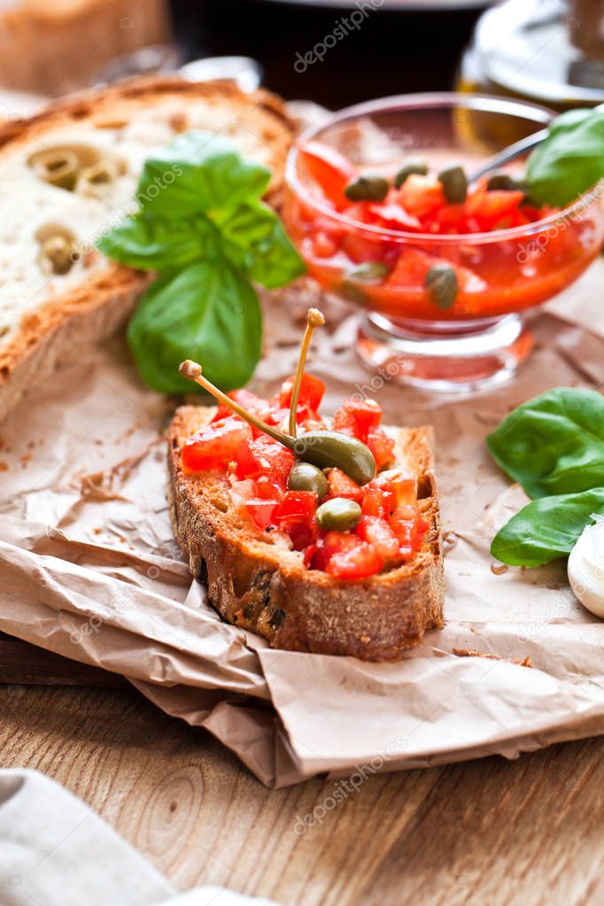 Italian cooking concept. Bruschettas with pesto, tomatoes
