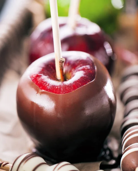 Table with colored candy apples