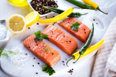 fresh raw salmon fillet with aromatic herbs  spices clipart