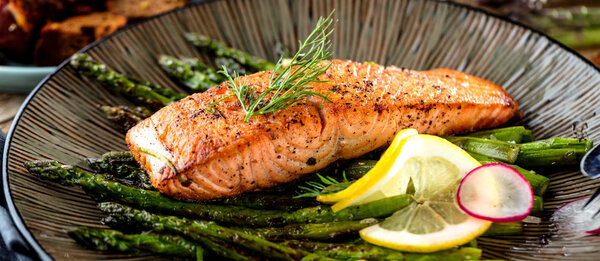 Grilled salmon and asparagus close up