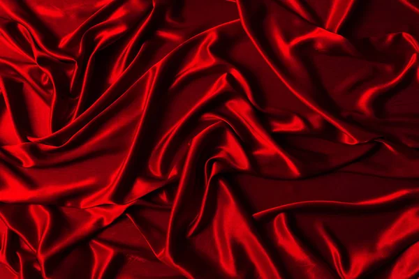 Red cloth waves background texture. chrismas background