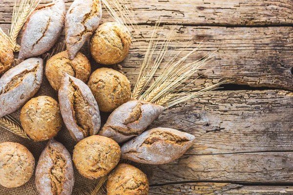 Different Kinds Fresh Bread Wooden Table Isolated Assortment Bread Brown — Stock Photo, Image