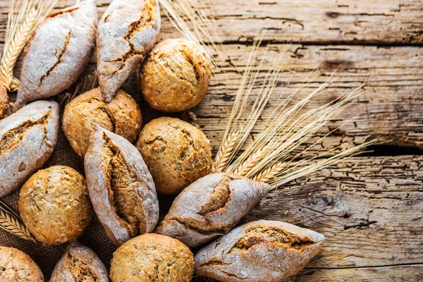 Different Kinds Fresh Bread Wooden Table Isolated Assortment Bread Brown — Stock Photo, Image