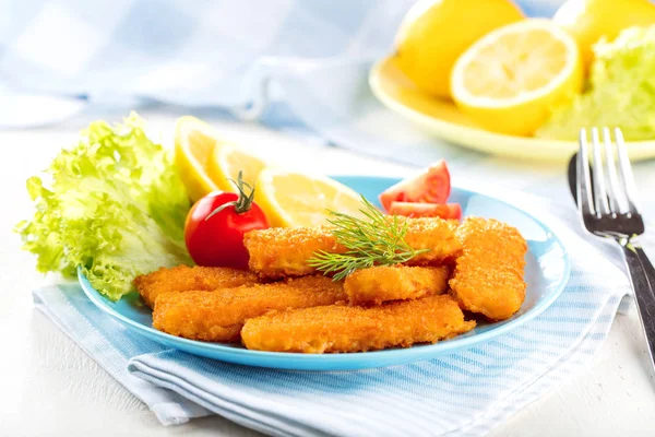 Fried Fish Sticks. Fish Fingers. Fish Sticks with lemon and sauces ready to eat.