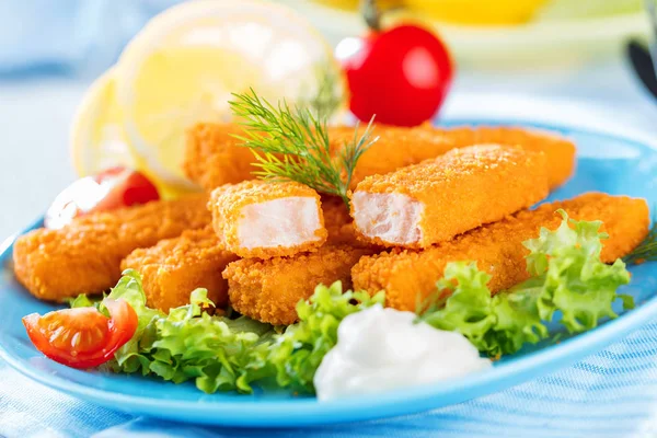 Fried Fish Sticks. Fish Fingers. Fish Sticks with lemon and sauces ready to eat.