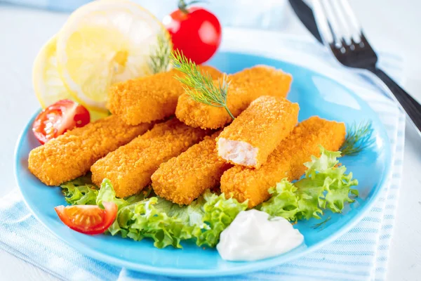 Fried Fish Sticks. Fish Fingers. Fish Sticks with lemon and sauces ready to eat.