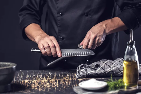 man sharpening knife, close up