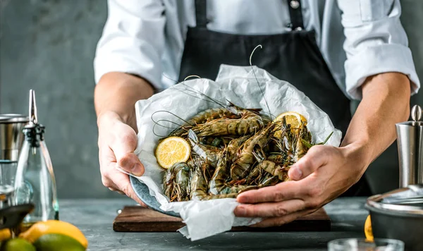 stock image Chef cooking with Tiger prawn on dark background 