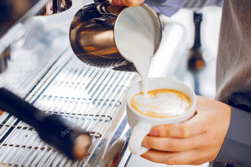 Close-up of espresso pouring from coffee machine. Professional coffee brewing