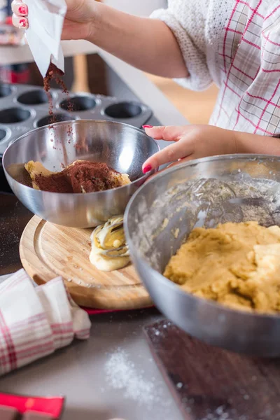 Christmas food concept. Woman is cooking gingerbread man cookies in Christmas close up.