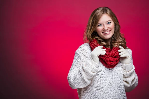 christmas smiling woman in sweater and Gloves