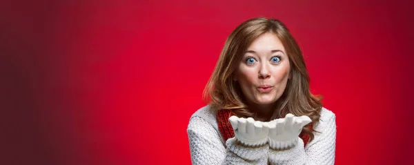 christmas smiling woman in sweater and Gloves