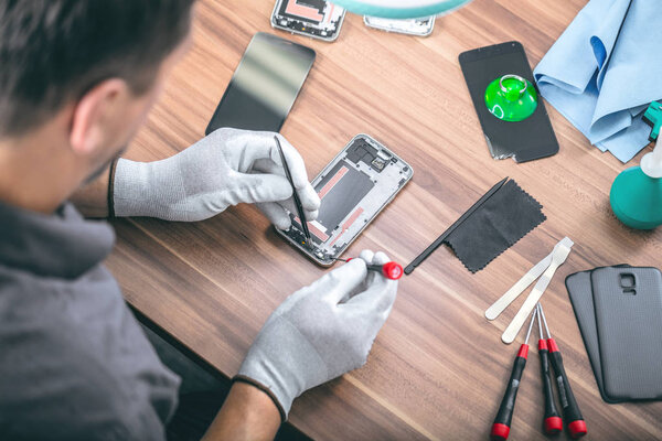 Close-up photos showing process of mobile phone repair