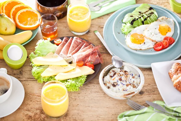 Homemade delicious american breakfast on dark wooden table