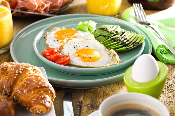 Homemade delicious american breakfast on dark wooden table