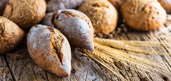 Different Kinds Fresh Bread Wooden Table Isolated Assortment Bread Brown — Stock Photo, Image