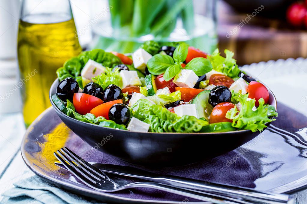 Fresh vegetables greek salad . Healthy food on wooden background