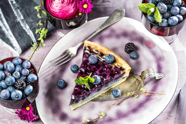 Sweet Cheese cakes with berries, mint and whipped cream. Top view