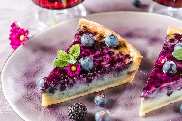 Sweet Cheese cakes with berries, mint and whipped cream. Top view