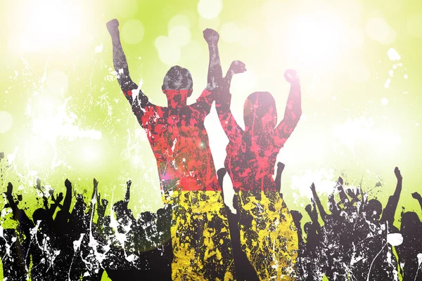 silhouettes of fans with raised arms and colors of german flag